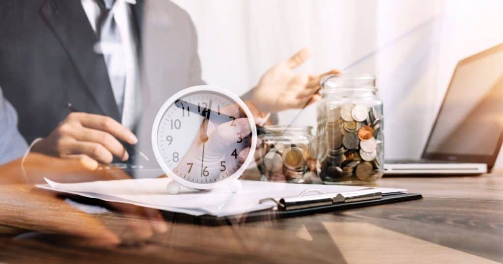 Clock, coins, and documents representing how startups save time and money via recruitment agencies