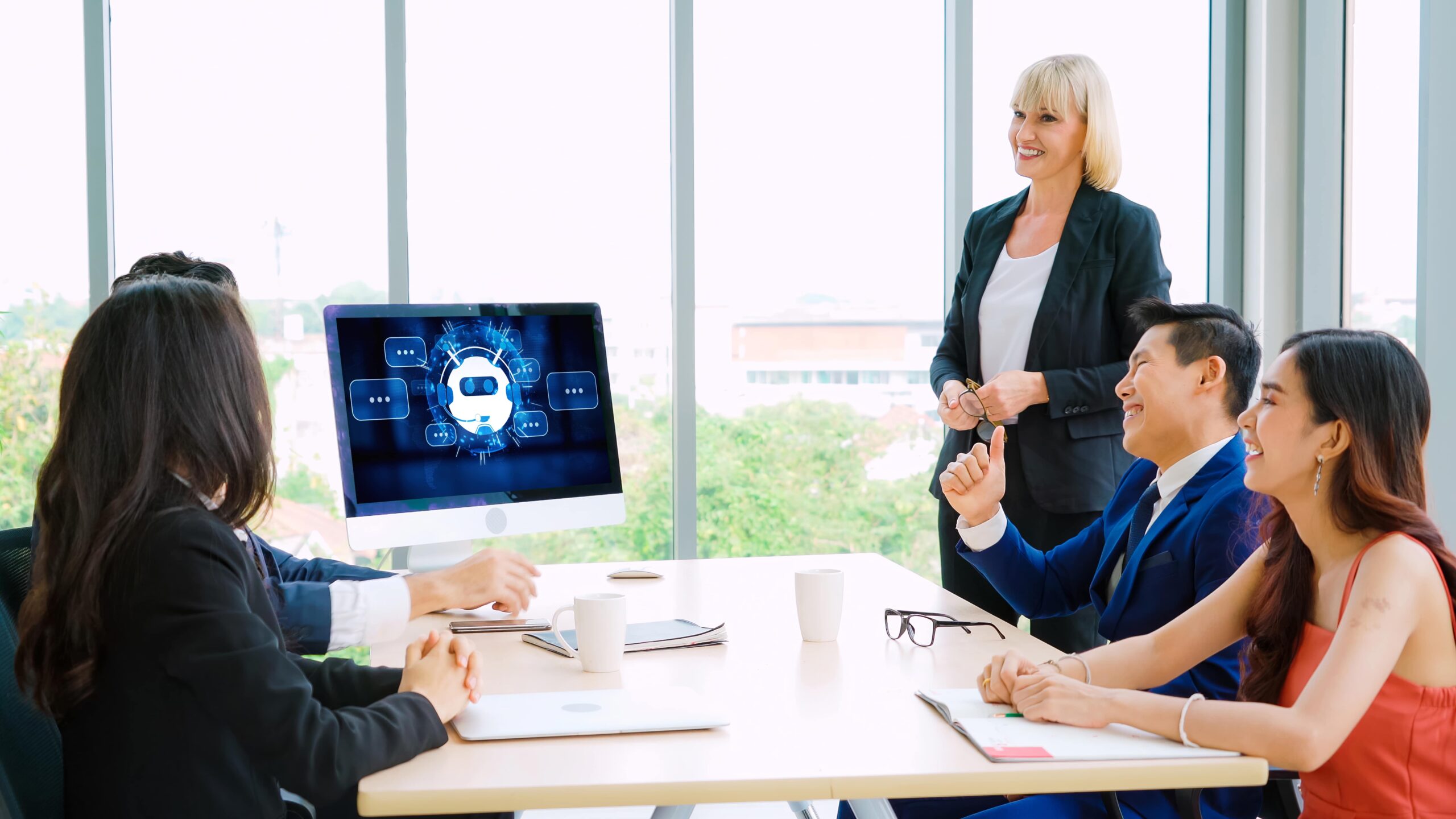 Team in a meeting room with an AI display, focusing on Technology Executive Search strategies and recruitment.