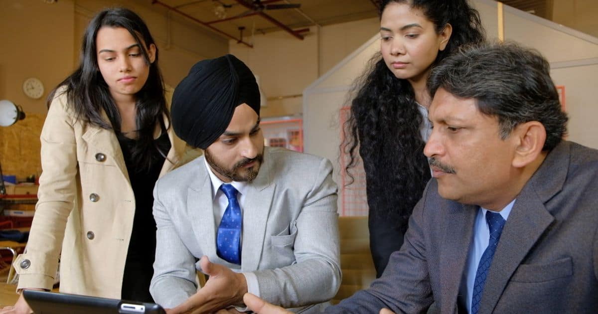 Team of professionals in a strategic hiring discussion at executive search firms.