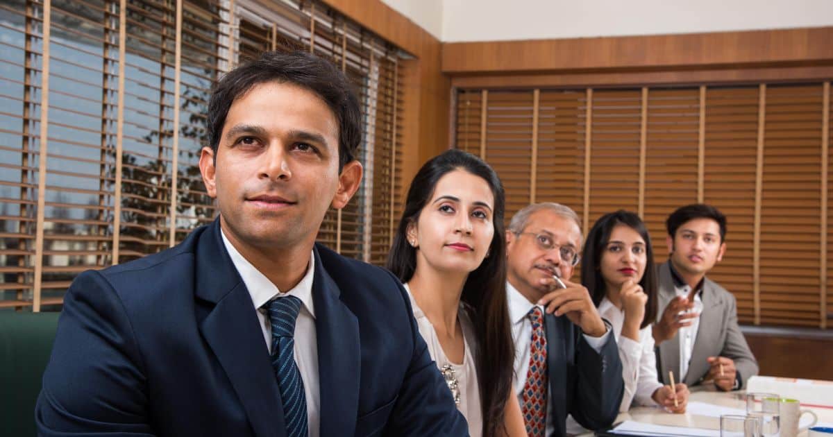 Two professionals discussing recruitment strategies at an Executive Search Firm in India during a client briefing.