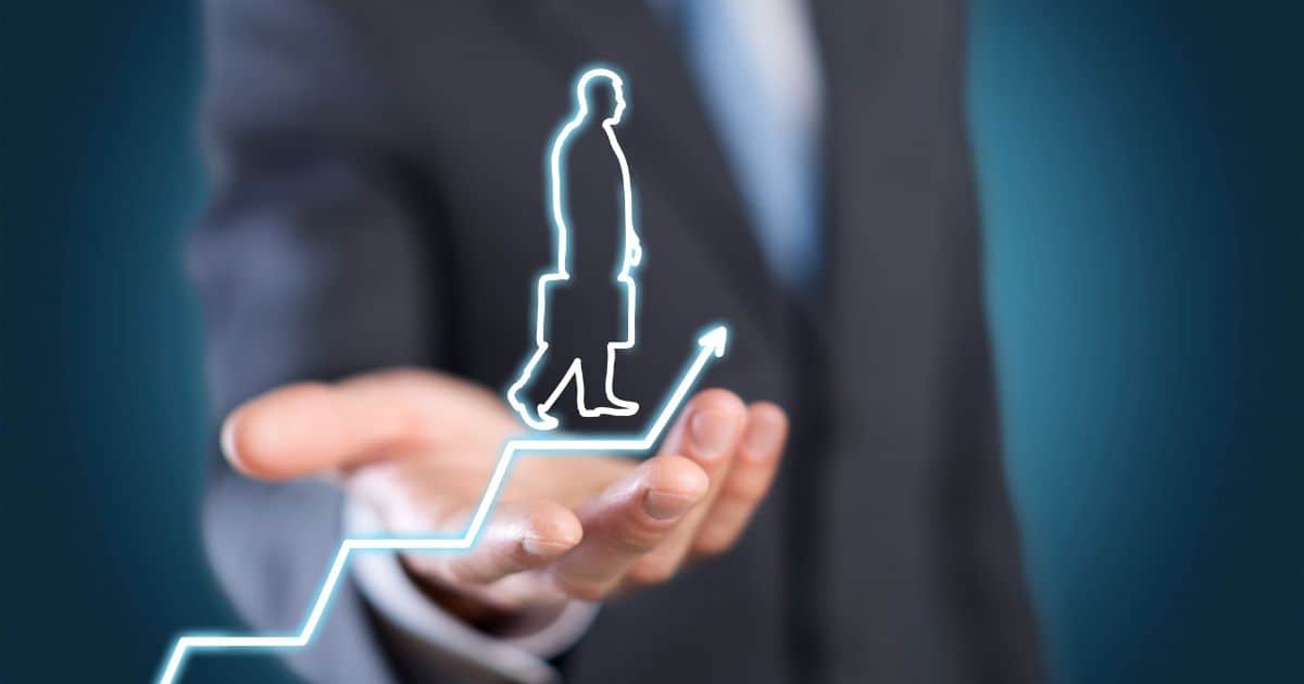 Suit-clad hand holding a digital figure on a rising graph, representing career growth in executive search.