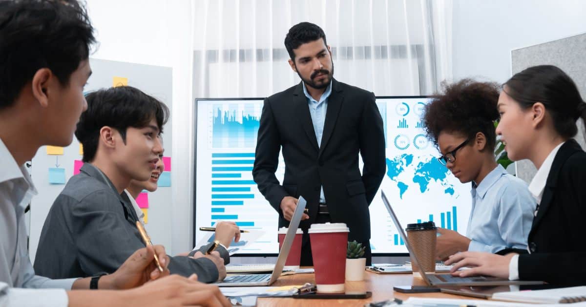 A focused management team discusses growth strategies, leading to an executive search for startups and scale-ups.