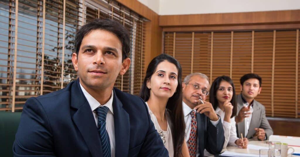 Two professionals discussing recruitment strategies at an Executive Search Firm in India during a client briefing.