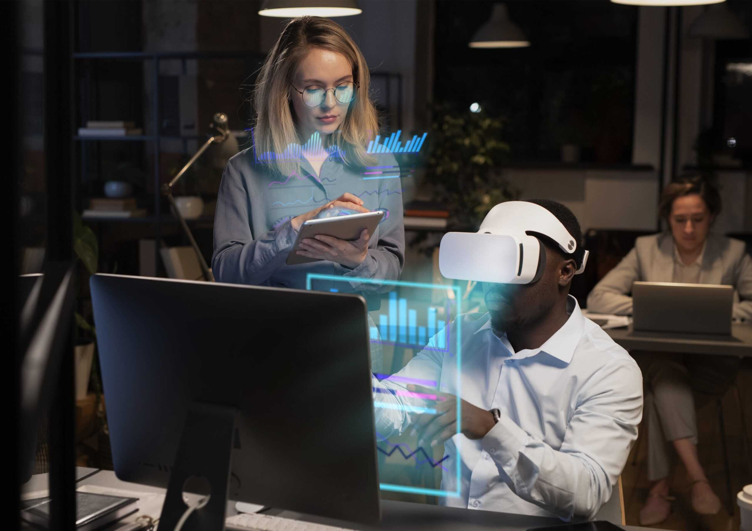 Professional in VR headset analyzing data with a colleague, focusing on Technology Executive Search innovations.